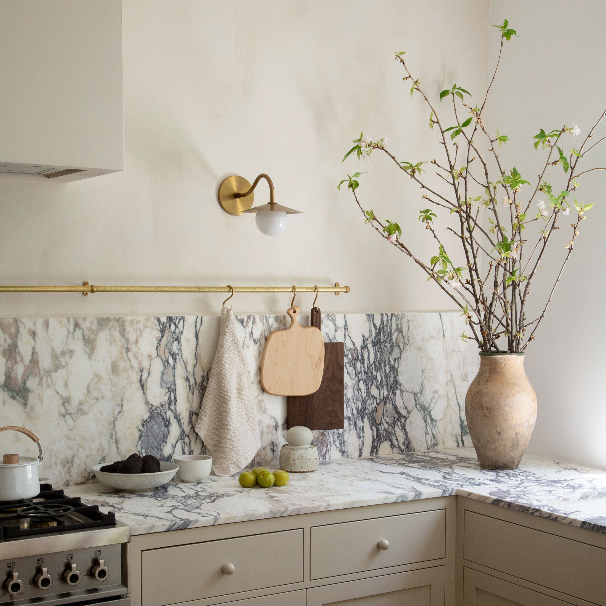 Alto Rod 12" globe pendant shown in Brass. Interior design by Sarah Sherman Samuel.