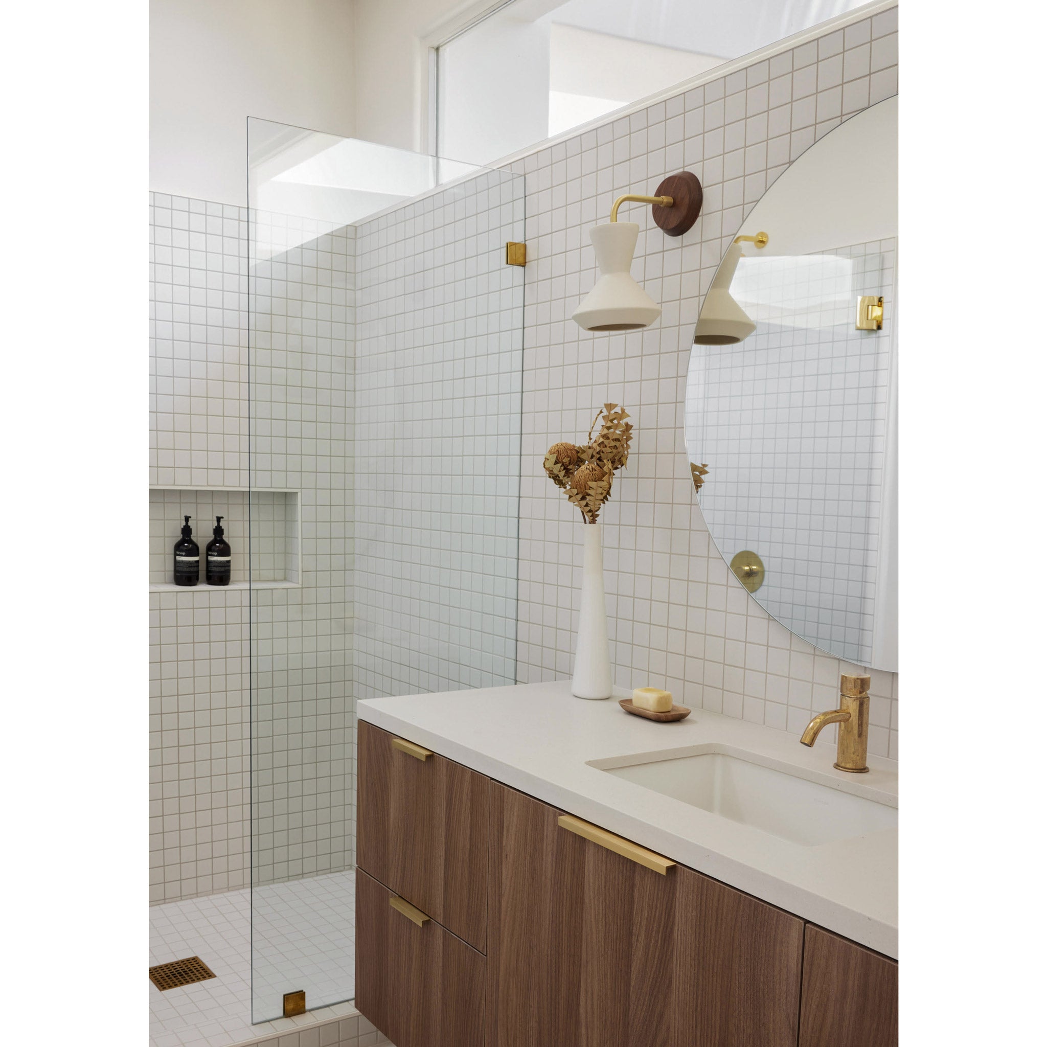 Bobbie Sconce shown in natural white Glaze ceramic with a brass metal finish and walnut canopy. Interior Design by Stephanie Brown Inc, Photographed by Phil Crozier