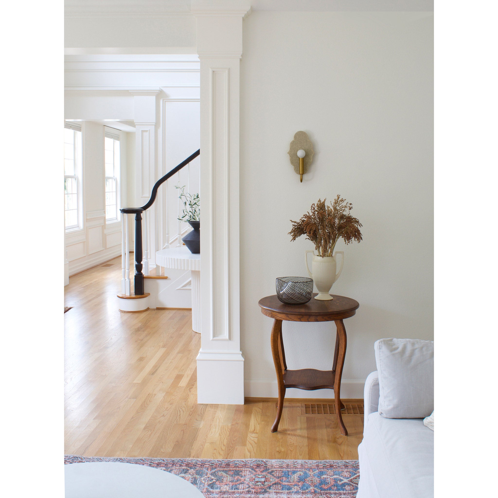 Clare Ceramic Sconce shown in Heirloom Brass with a Gloss Crackle Glaze