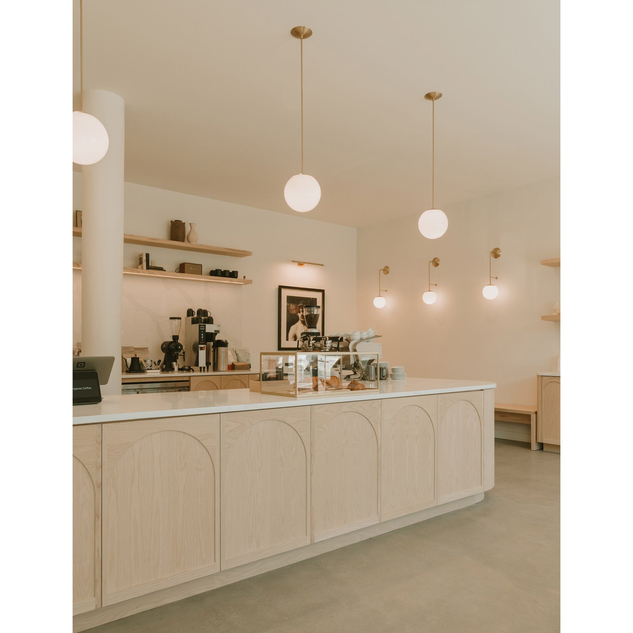 Alto Rod 10" Pendants and Ramona 8" Sconces in Brass. Hypnos Coffee interior by Fieldwork Design, Photography by Absence Studio