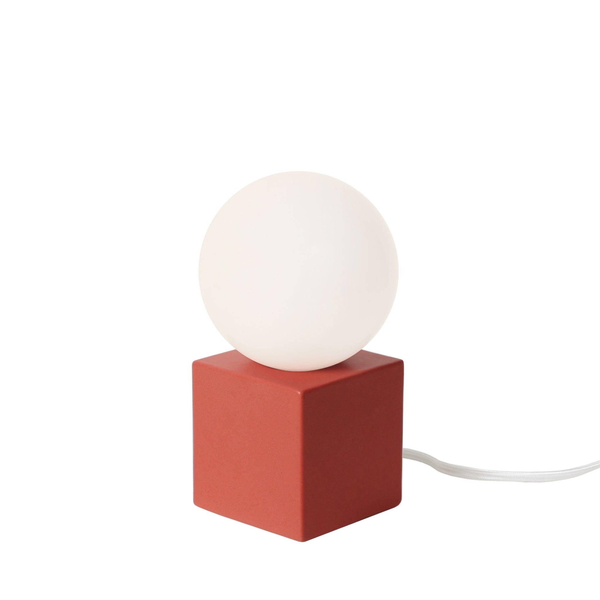 Little Meg Lamp shown in Matte Coral Rose Glaze ceramic