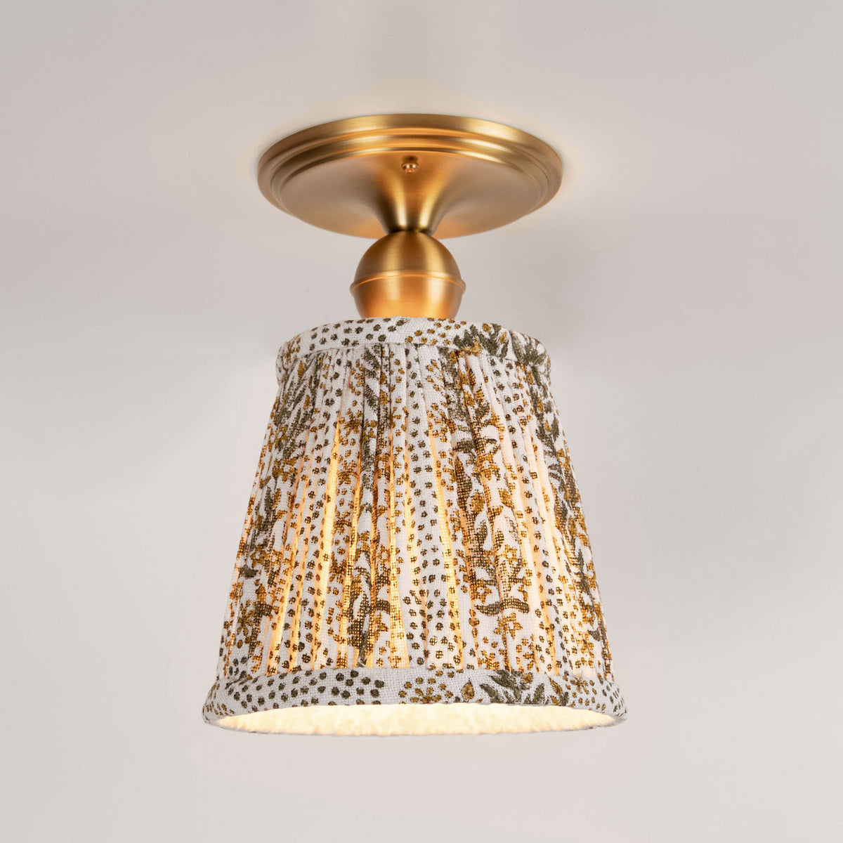 Oxford Surface shown in Heirloom Brass with a Winfleur Mustard Shade