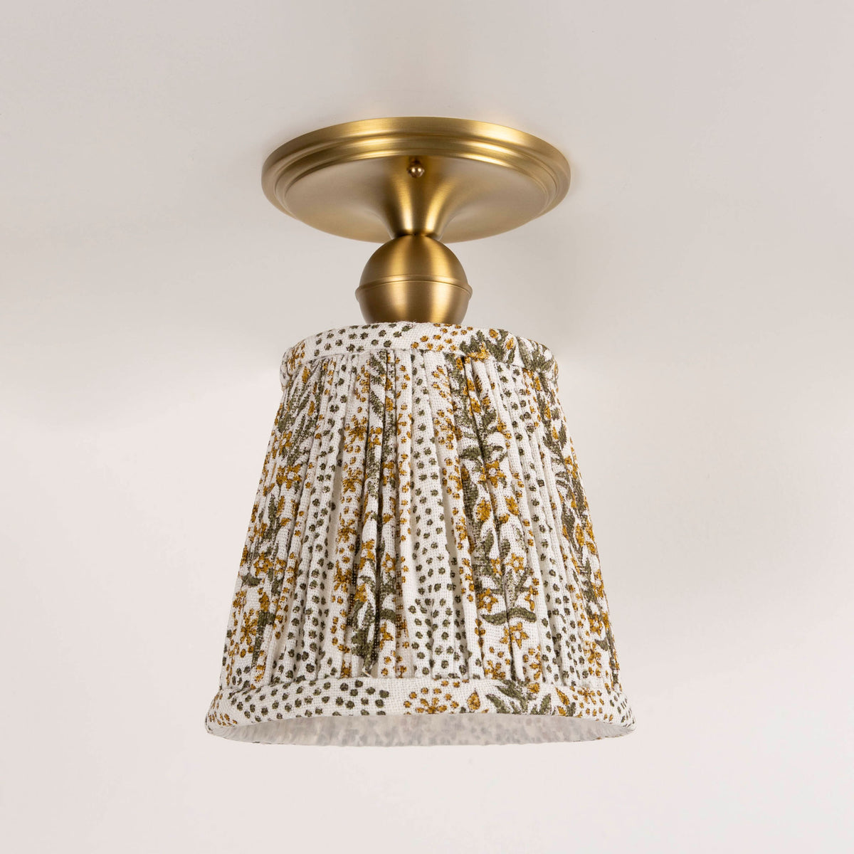 Oxford Surface shown in Heirloom Brass with a Winfleur Mustard Shade