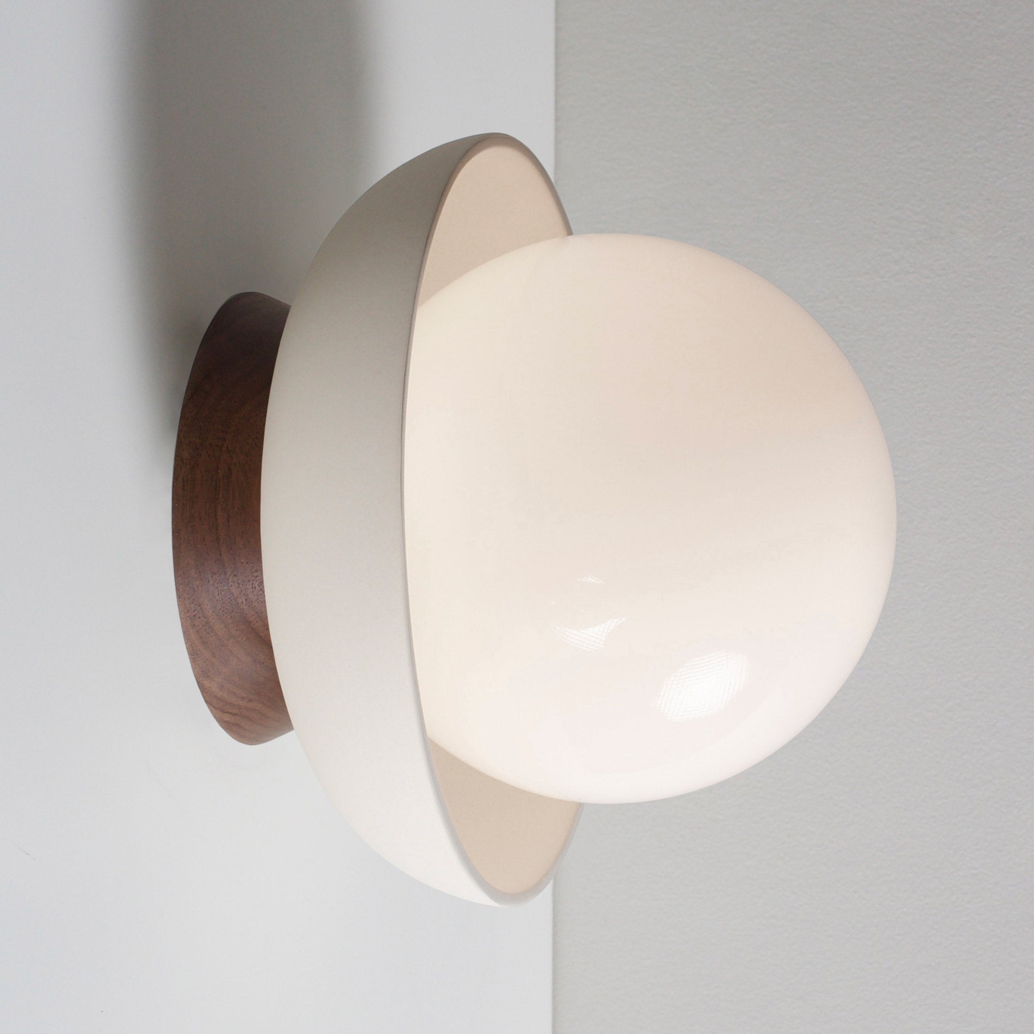 Terra Lexi shown in Bone ceramic and Walnut wood canopy