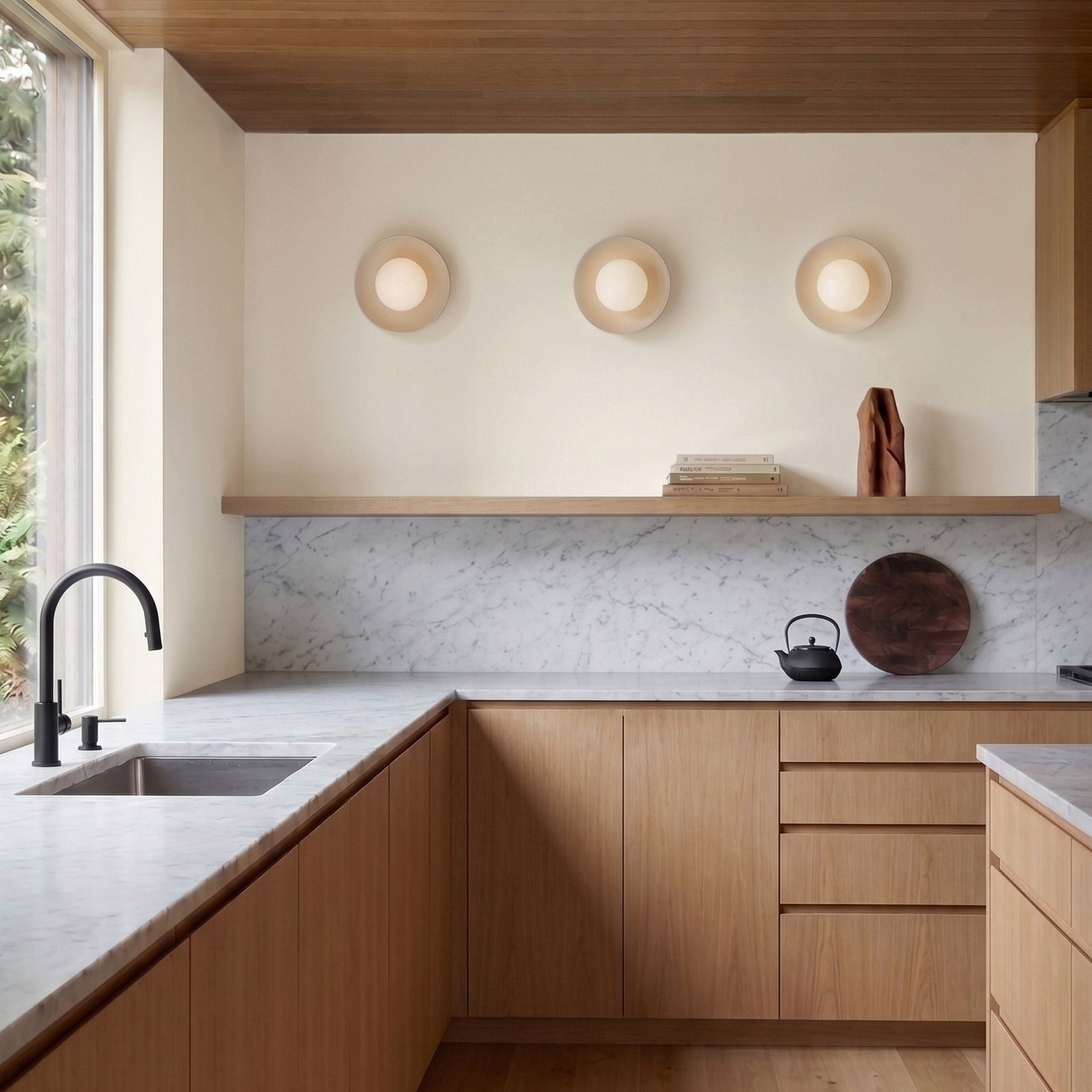 Terra Lexi Large 6" Sconces shown in Bone ceramic