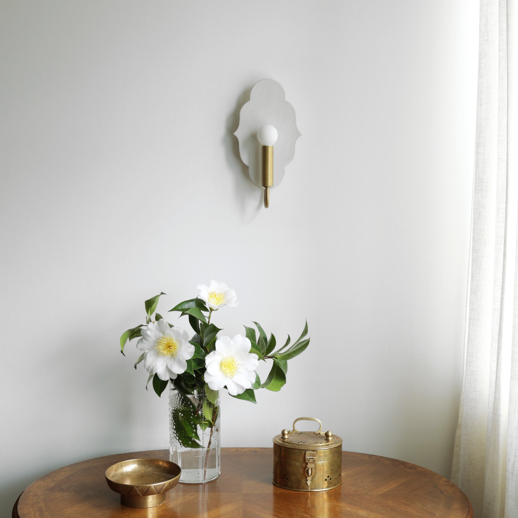 Clare Ceramic Sconce shown in Heirloom Brass with a Natural White Glaze