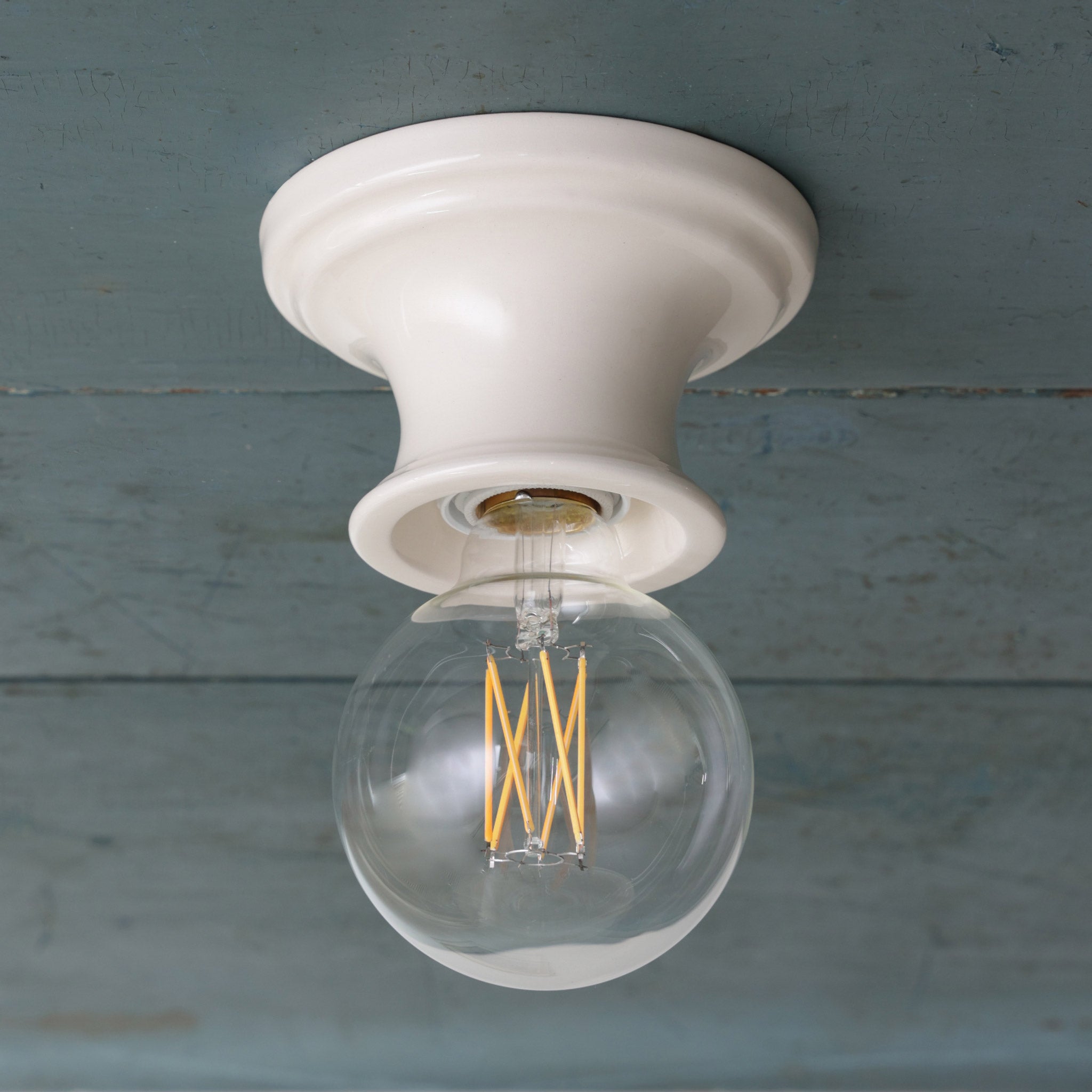 Emma Petite in Gloss White Glaze with a G30 LED Filament Light Bulb