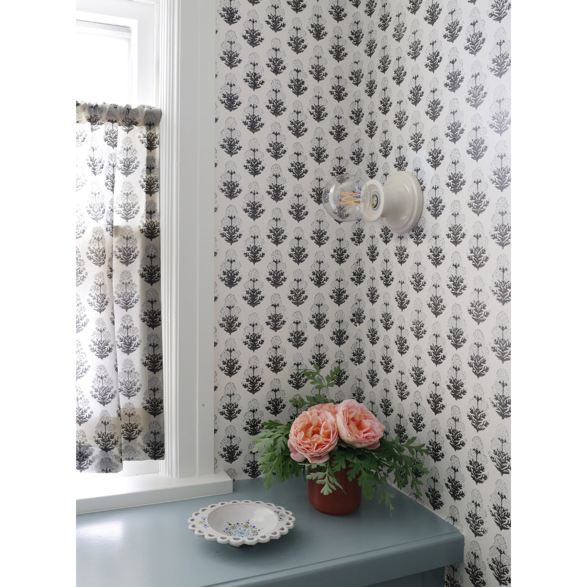 Emma Petite shown in Gloss White Glaze with Marigold wallpaper and fabric from Filling Spaces