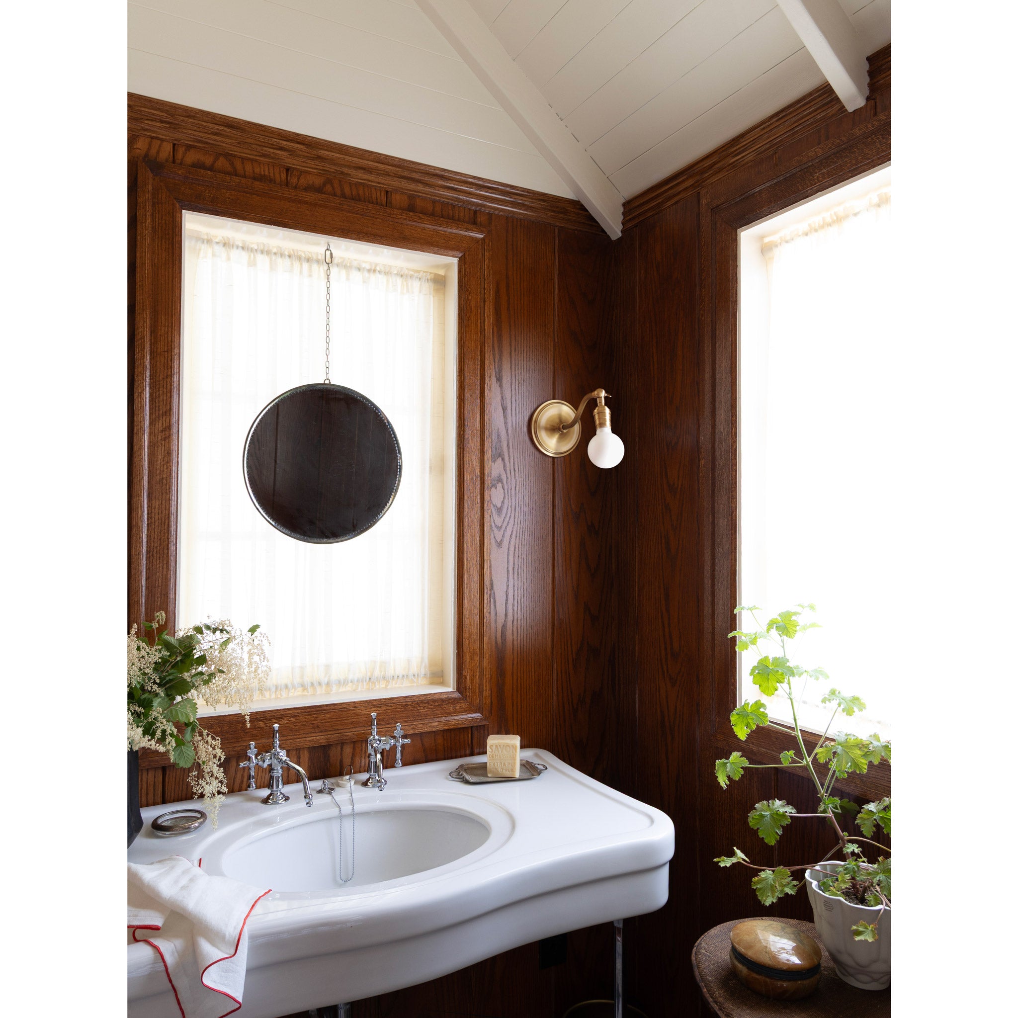 Grace Sconce shown in Heirloom Brass with no shade and a Tala Sphere II Bulb. Interior design by Sarah J. Meyer Design