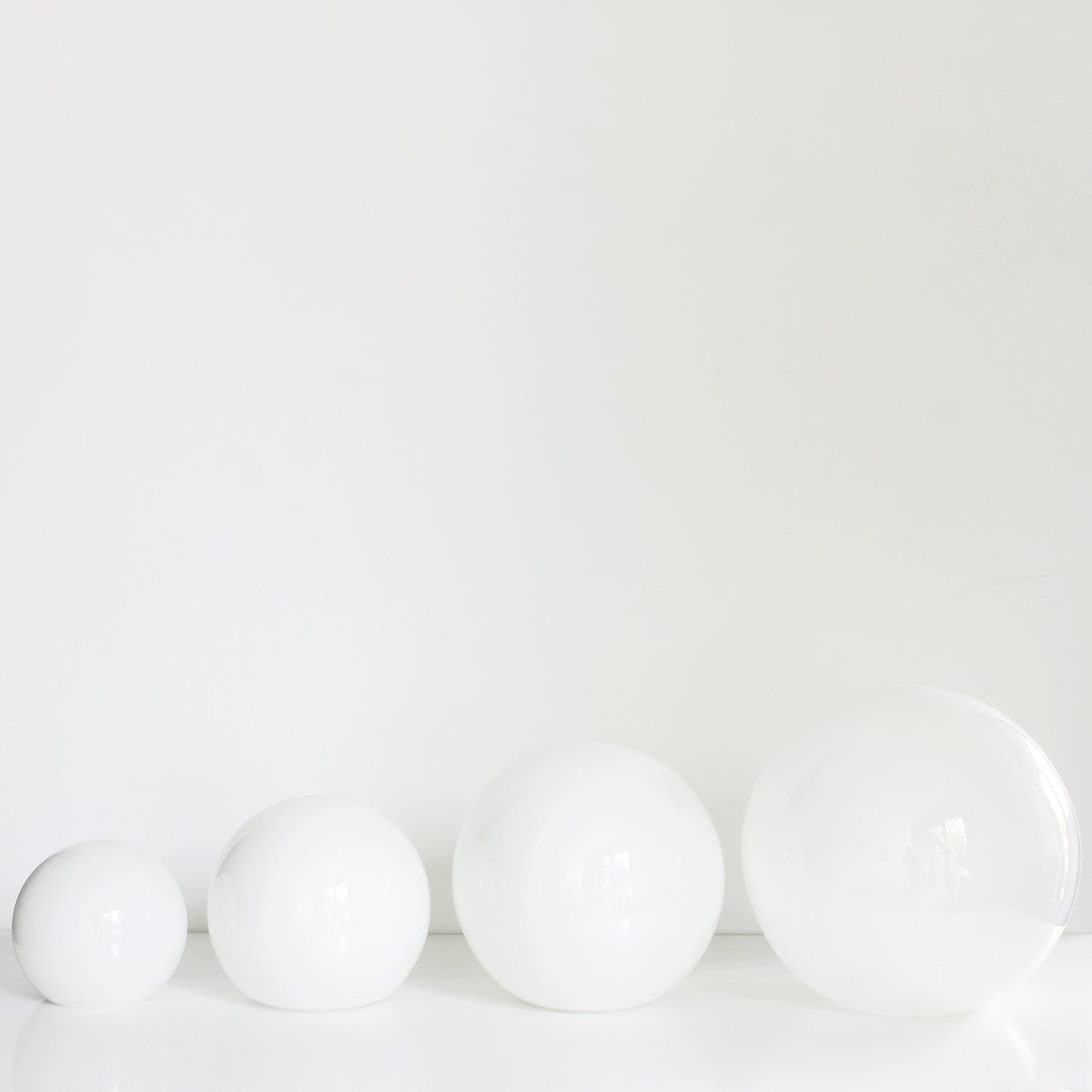 Opal Glass Globe Replacements shown in 5", 6", 8", 10".