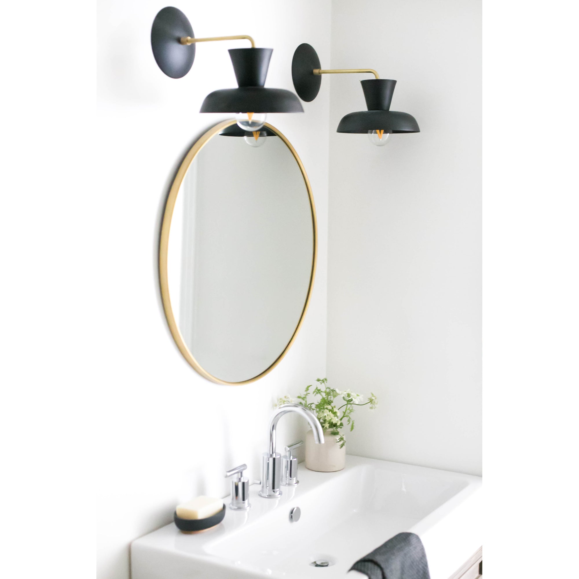 Isle Sconces shown in Matte Black with Brass. Interior Design by Ames Interiors