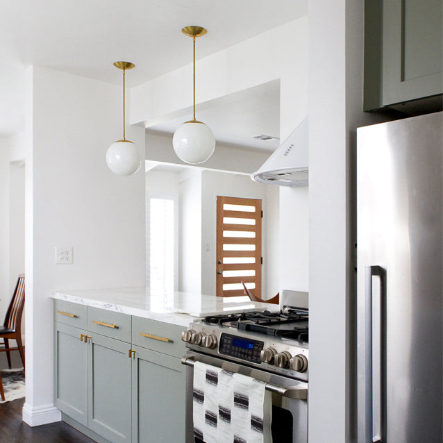 Alto Rod 10" shown in Brass with Opal 10" globes. Interior Design by Sarah Sherman Samuel for Smitten Studio