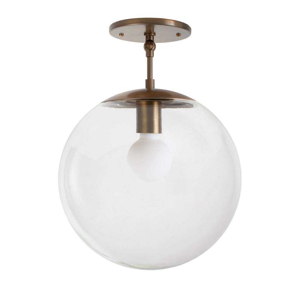 Alto Surface 12" for Vaulted Ceiling shown in Heirloom Brass with a Clear 12" Globe.