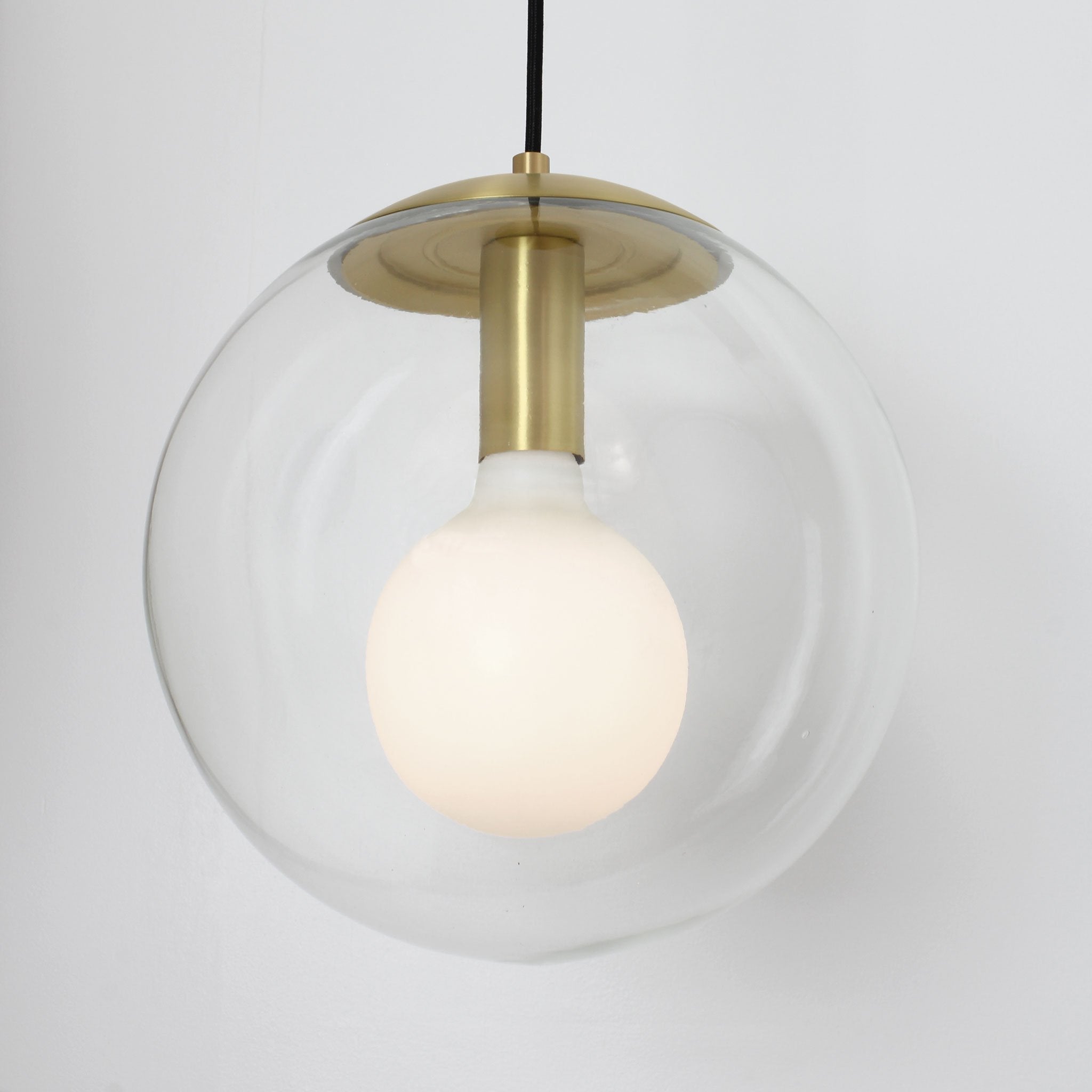 Alto Cord 12" shown in Brass with a Clear 12" globe and Black Cloth cord