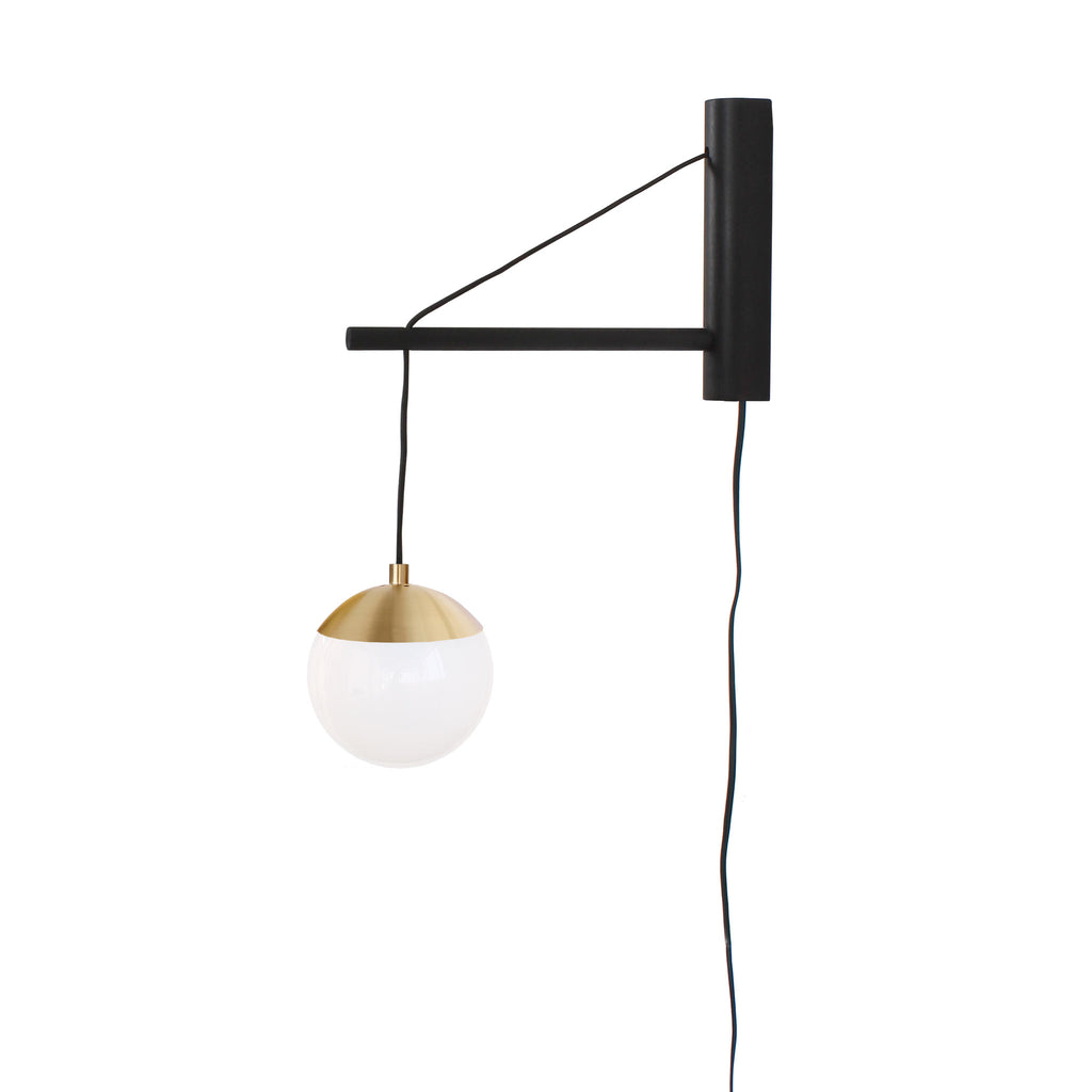 Alto 14" Wood Arm Sconce shown in Brass with a Black Stained Wood Finish, a 6" Opal globe, and a Black Plug-in Cord.