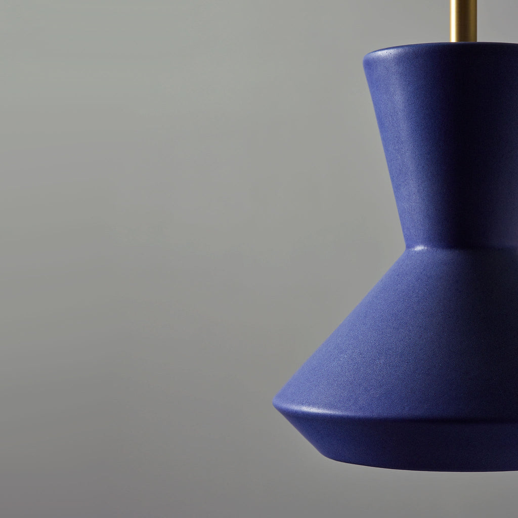 Bobbie Rod Pendant for Vaulted Ceiling shown in Cobalt Blue Glaze Ceramic with aBrass Metal finish.