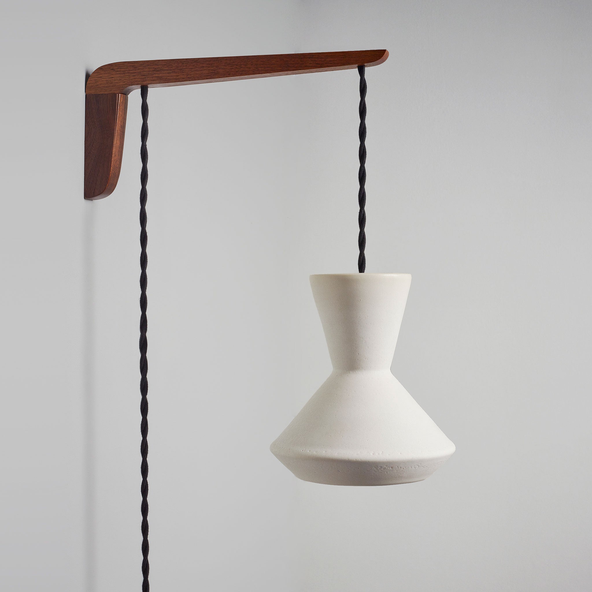 Bobbie Swing shown in Natural White Glaze with Walnut wood and Black Twist cord