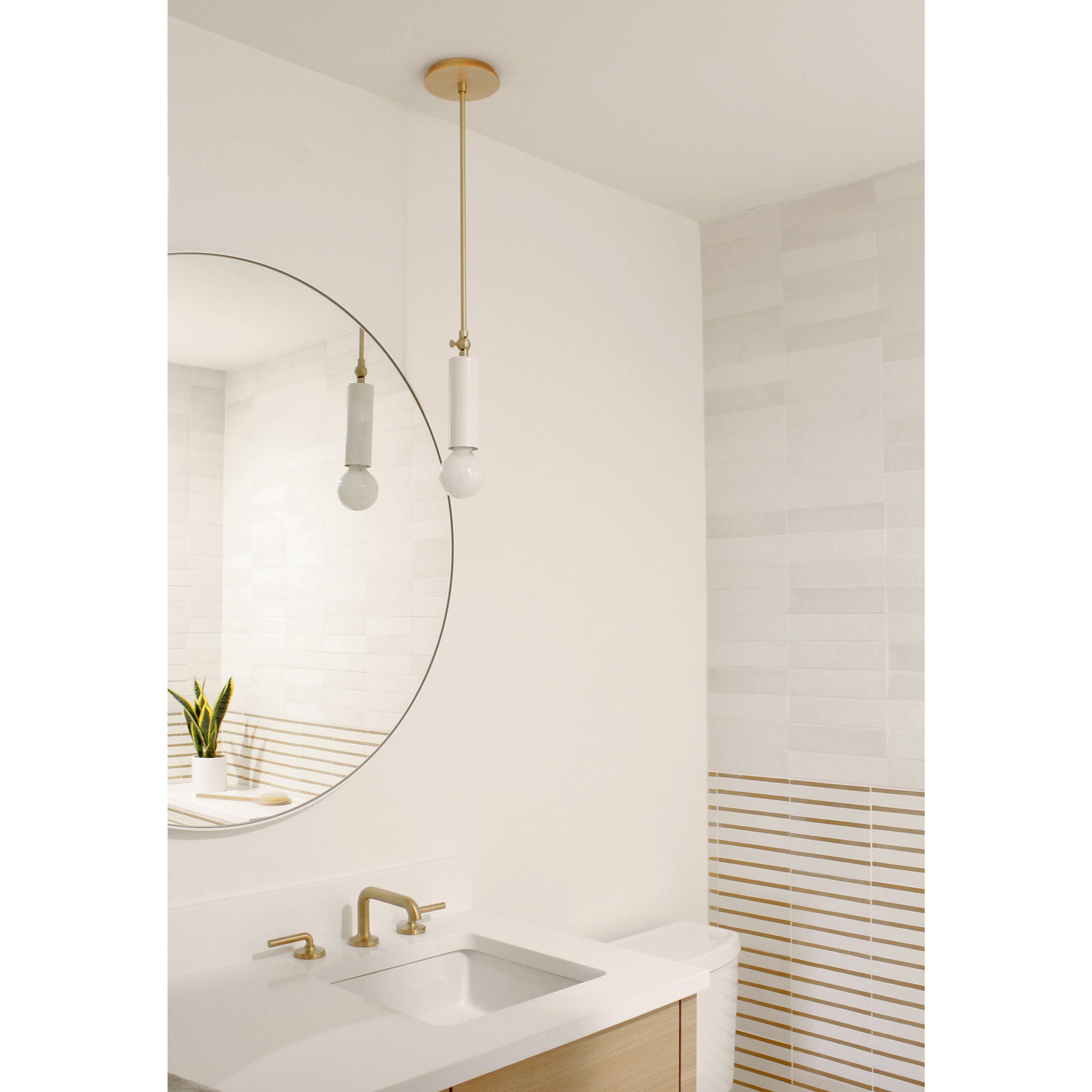 Fjord Spot Pendant shown in White with Brass with Standard Socket Placement. Interior design by Teal Davison