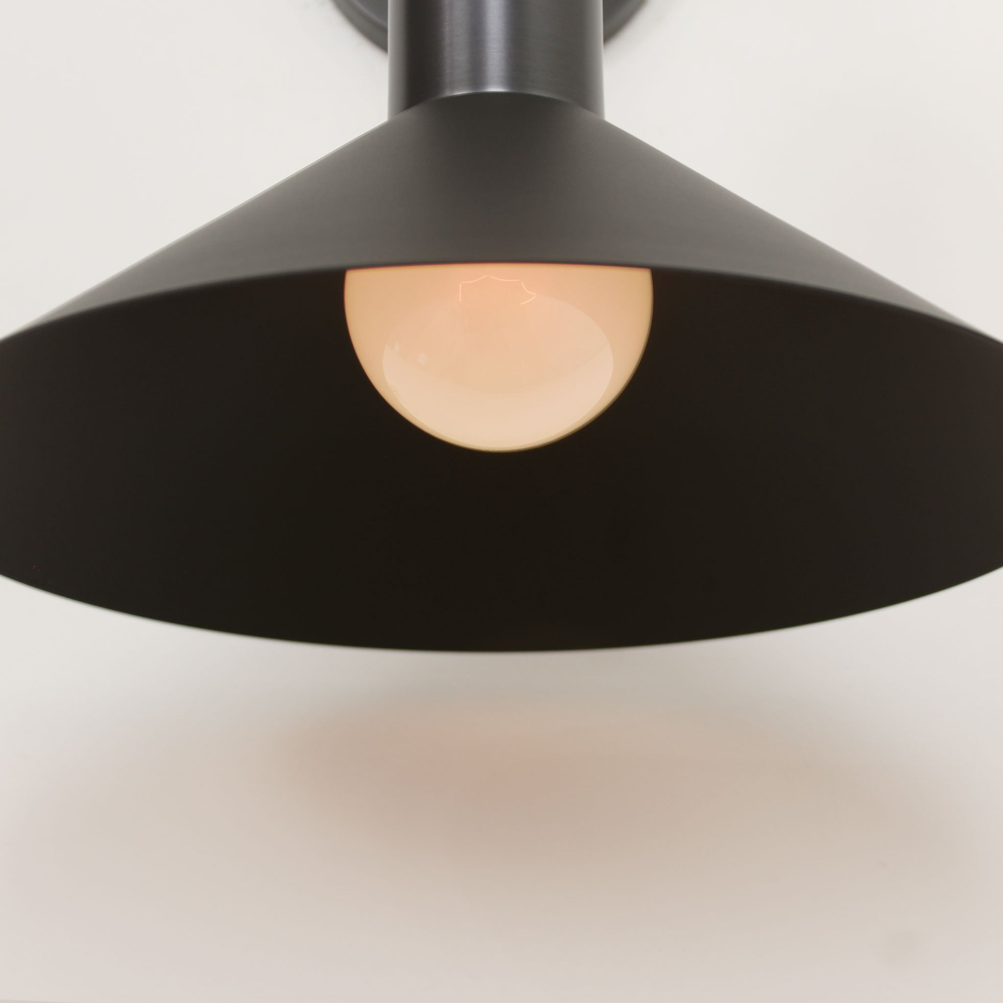 June Sconce shown in Matte Black with Graphite Patina