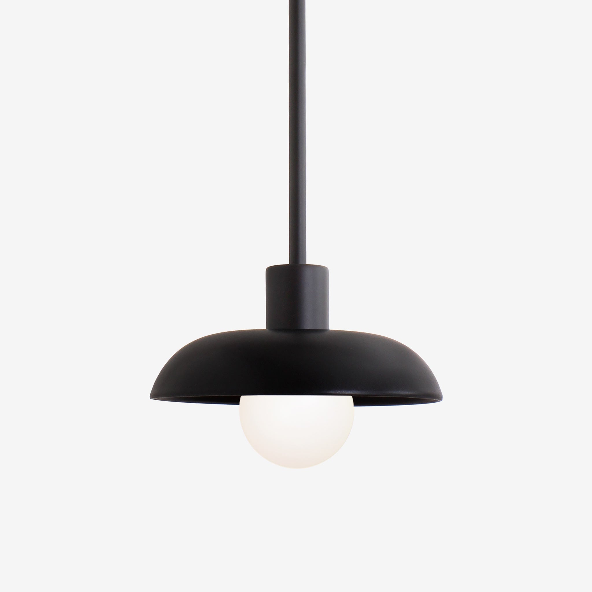 Terra Pendant for Vaulted Ceiling shown in Matte Black Ceramic finish with Matte Black metal