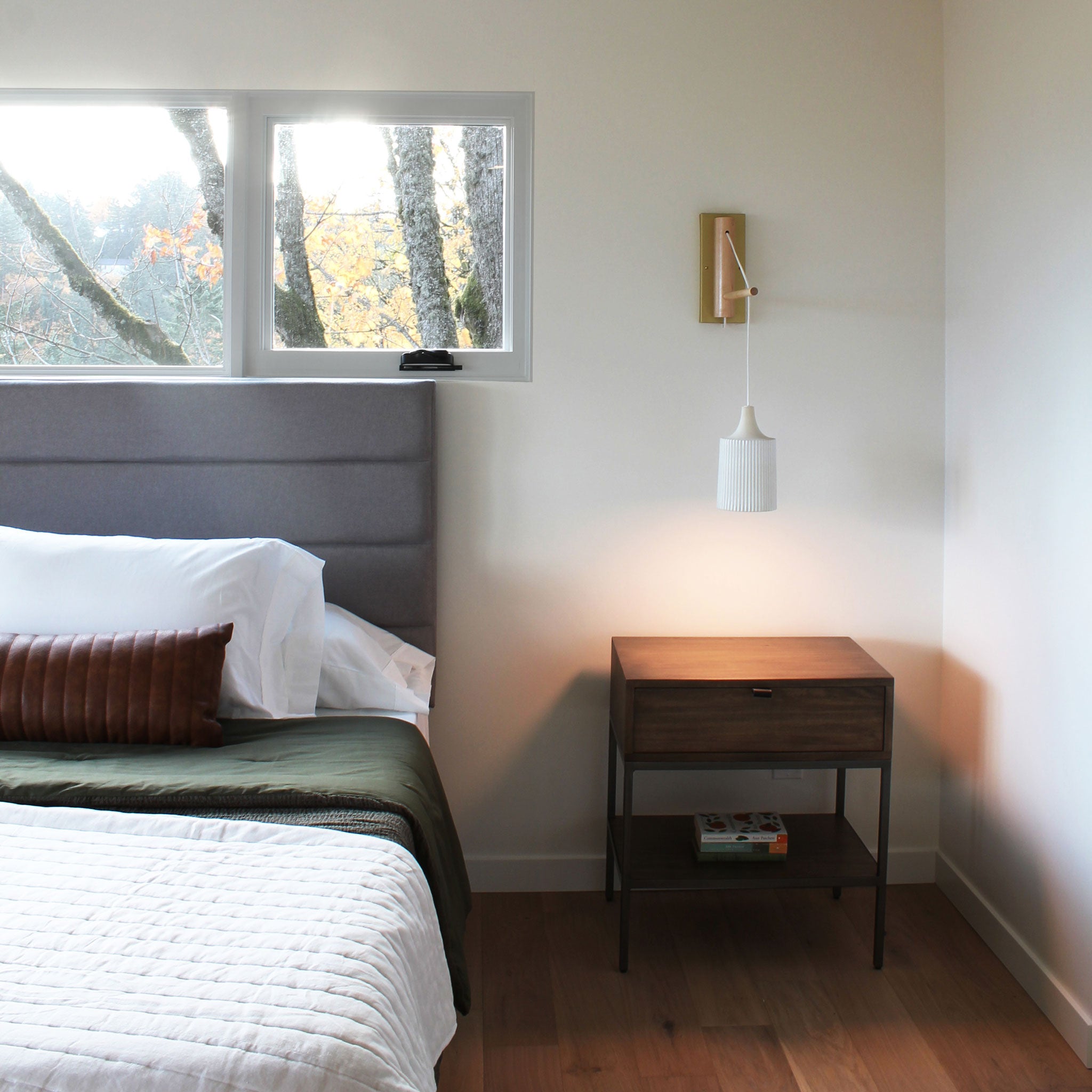 Tumwater 14" Wood Arm Sconce shown in Brass with Birch and a White Hardwired Cord. Interior Design by Teal Davison. Cedar and Moss.
