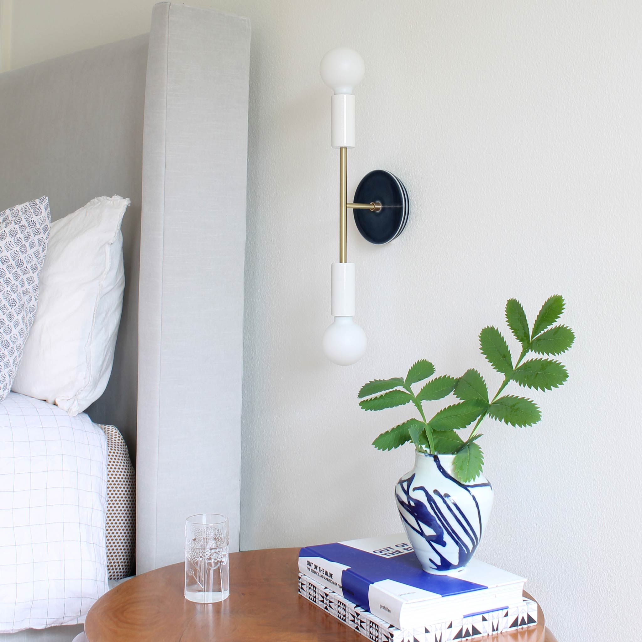 Venus Sconce shown in White with Brass with a Swift pattern Ceramic canopy in Indigo Blue
