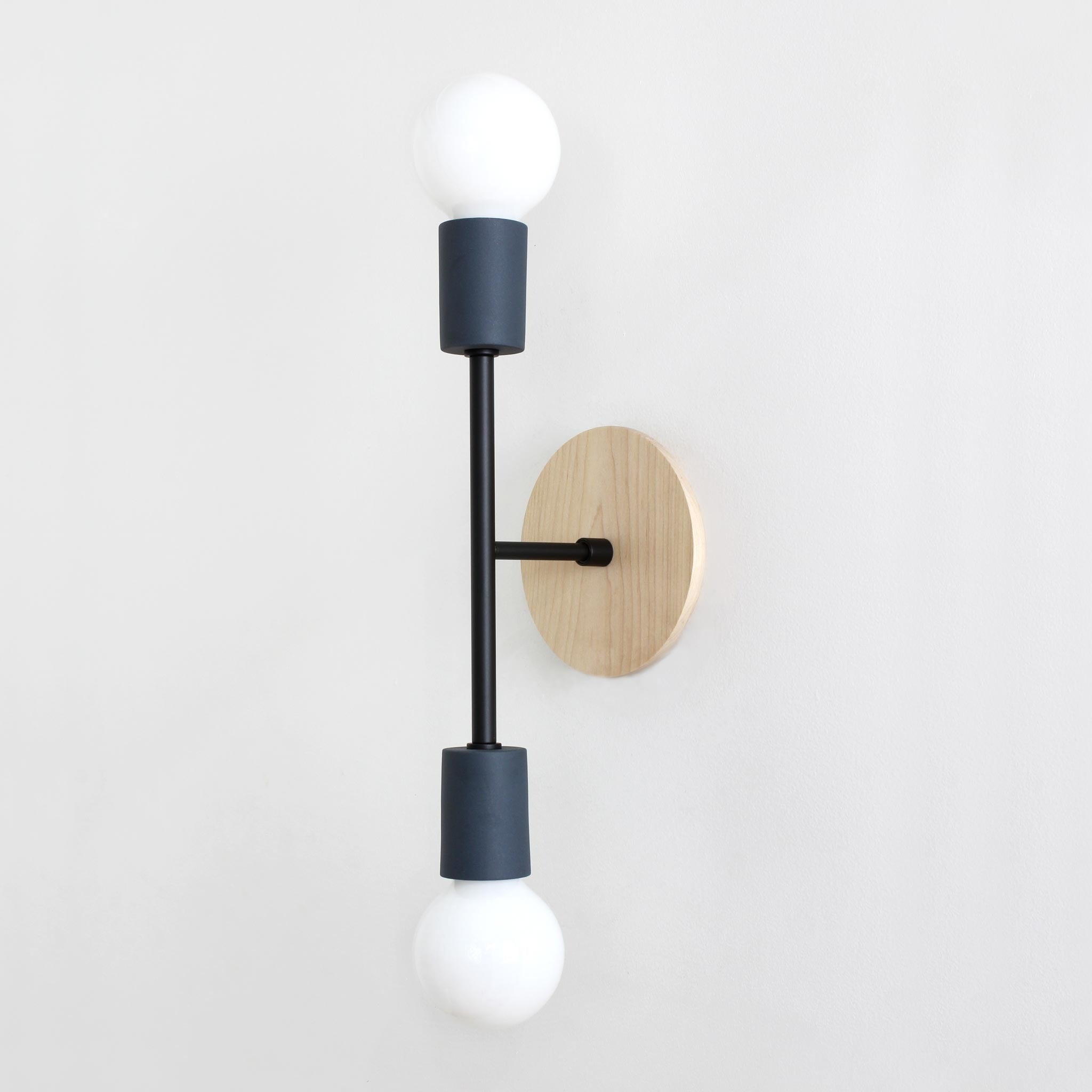 Verona shown in Denim ceramic finish with Matte Black metal and Maple canopy