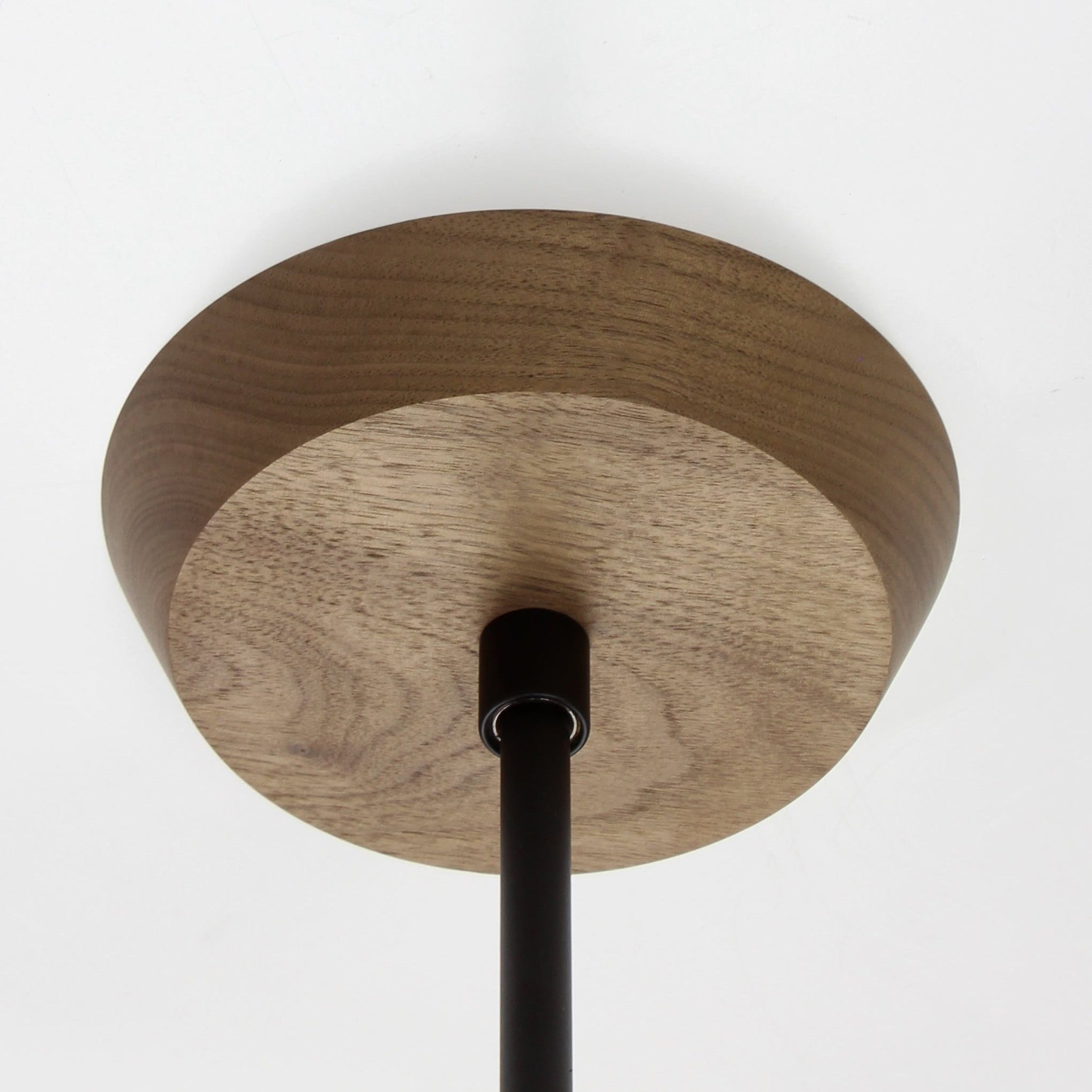 Mounting canopy shown in Walnut with Matte Black rod
