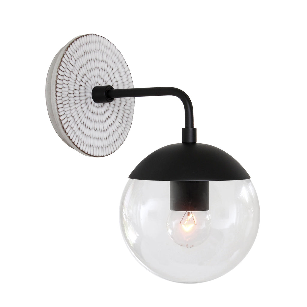 Alto Sconce 6" with Ceramic Canopy shown in Matte Black with a Brownstone White Sunflower Ceramic Canopy Pattern and a Clear 6" globe.