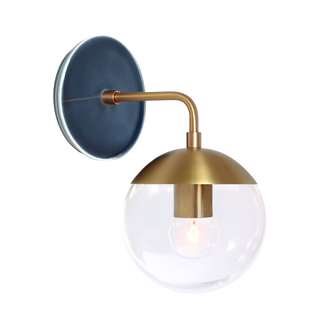 Alto Sconce 6" with Ceramic Canopy shown in Brass with an Indigo Blue Swift Ceramic Canopy Pattern and a Clear 6" globe.