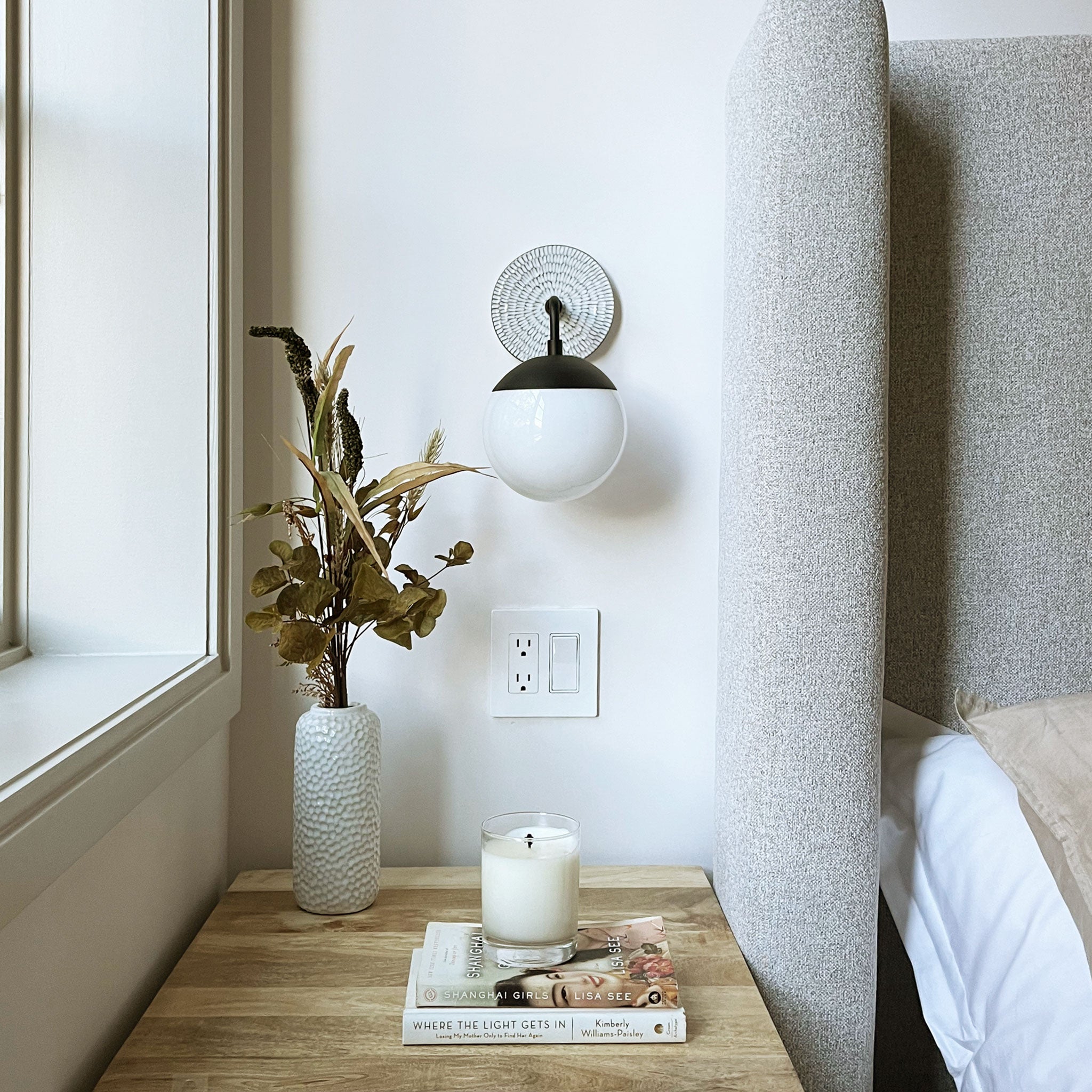 Alto Sconce 6" with Ceramic Canopy shown in Matte Black with a Brownstone White Sunflower Ceramic Canopy Pattern and an Opal 6" globe