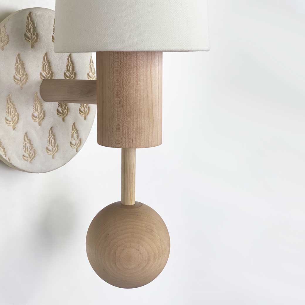 Amherst sconce shown in Maple with Natural White and Cream Floral Ceramic