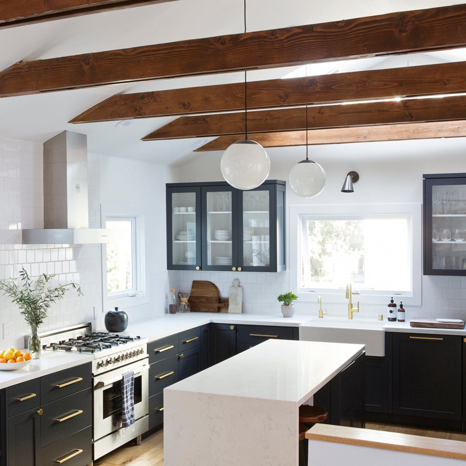 Alto Rod 12" for Vaulted Ceiling shown in Graphite Patina with Opal 12" globes. Interior design by Carly Waters. Photo by Vivian Johnson