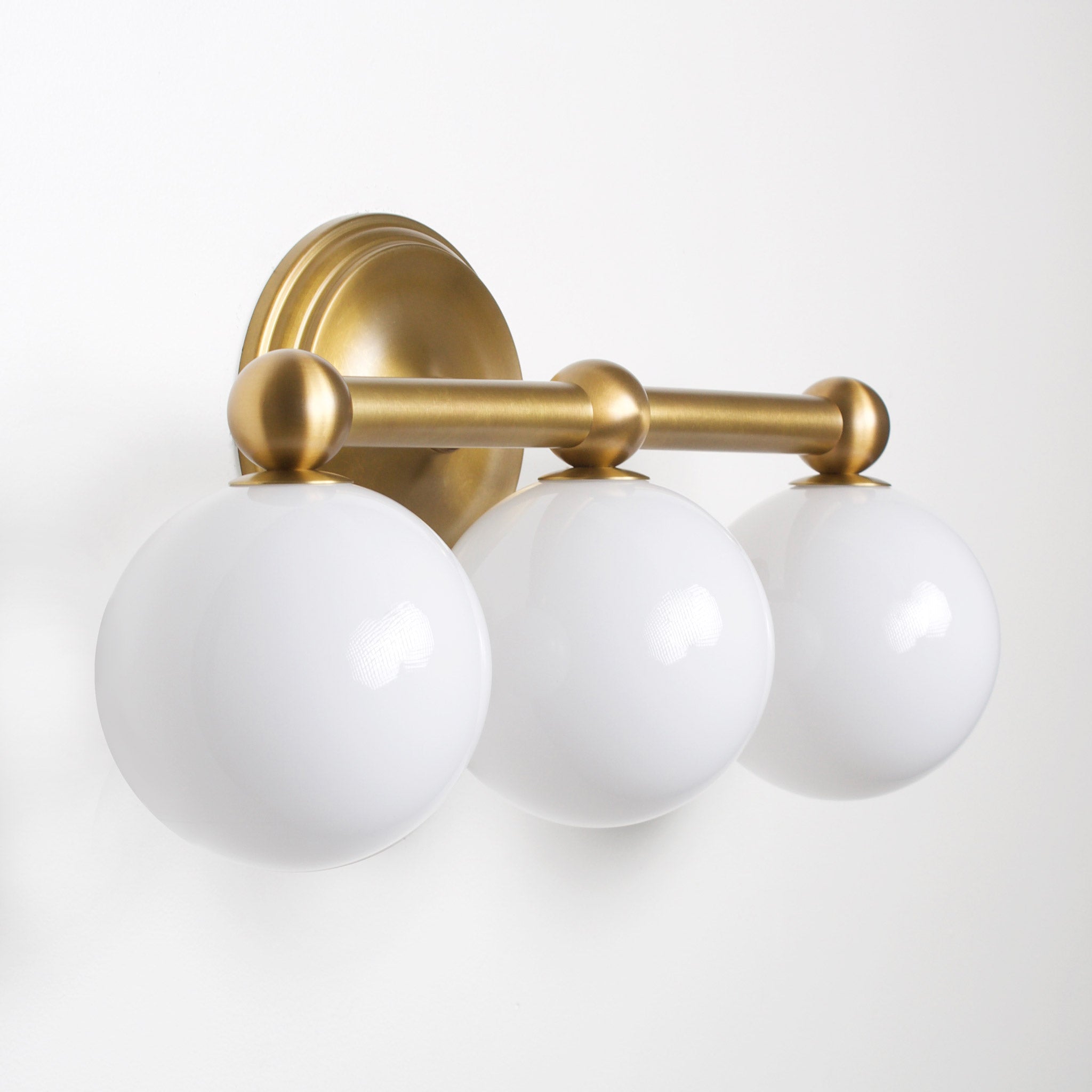 Eleanor Triple shown in Heirloom Brass