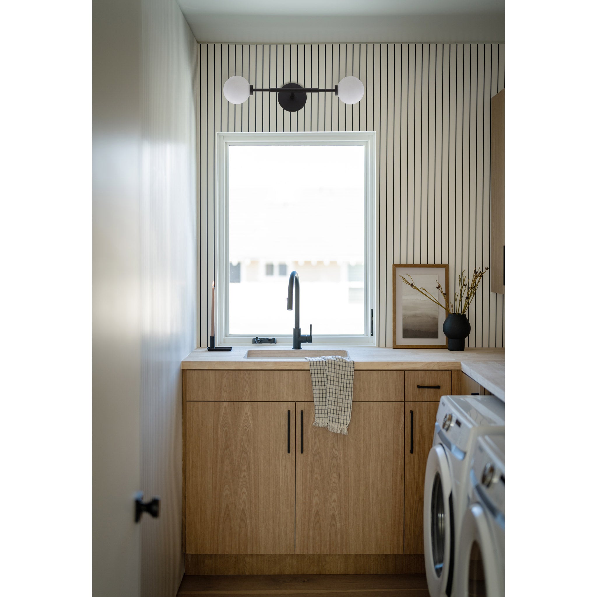 Heron Double Sconce shown in Matte Black. Interior Design by KH Interiors