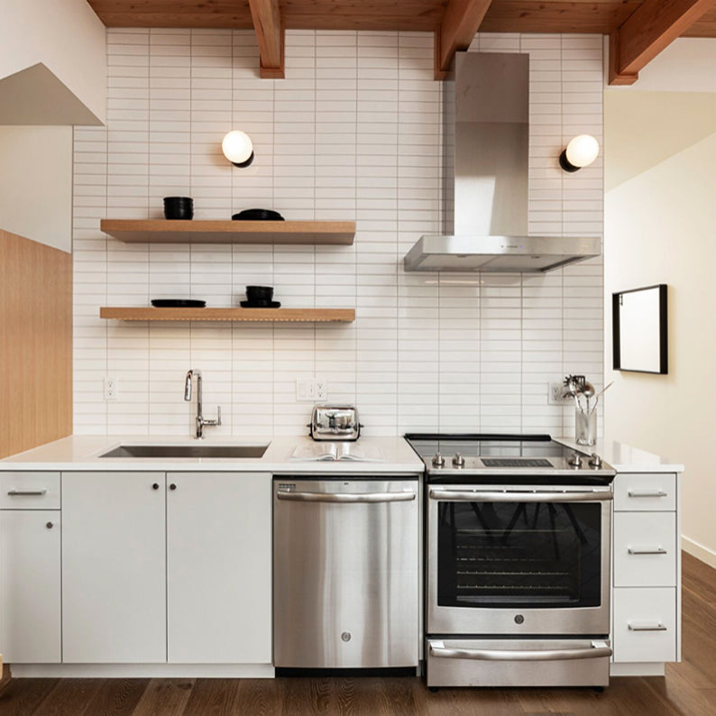 Moss 6" Sconce shown in Matte Black. Interior Design by Teal Davison Design