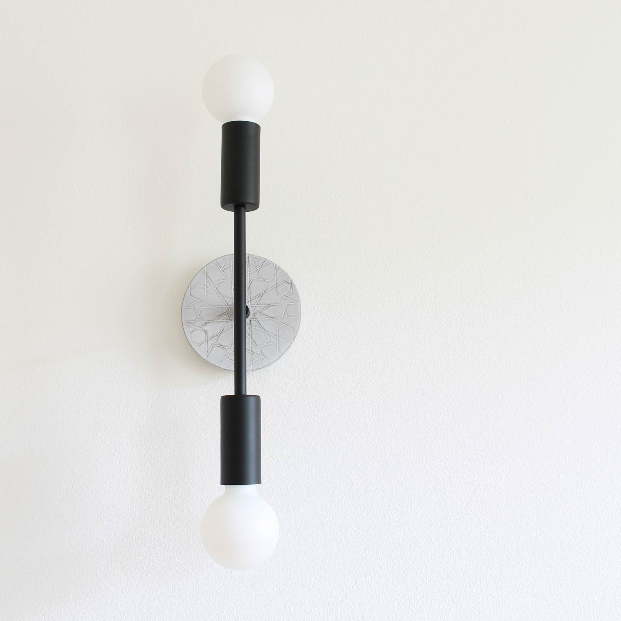 Venus with Ceramic Canopy shown in Matte Black with Star ceramic canopy pattern in Brownstone White