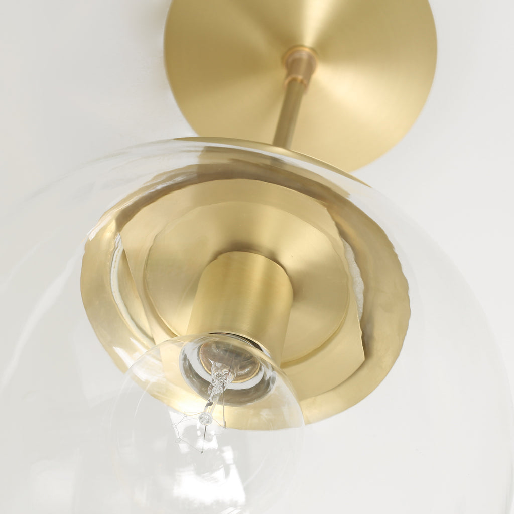Alto Surface 10" shown in Brass with a Clear 10" globe.