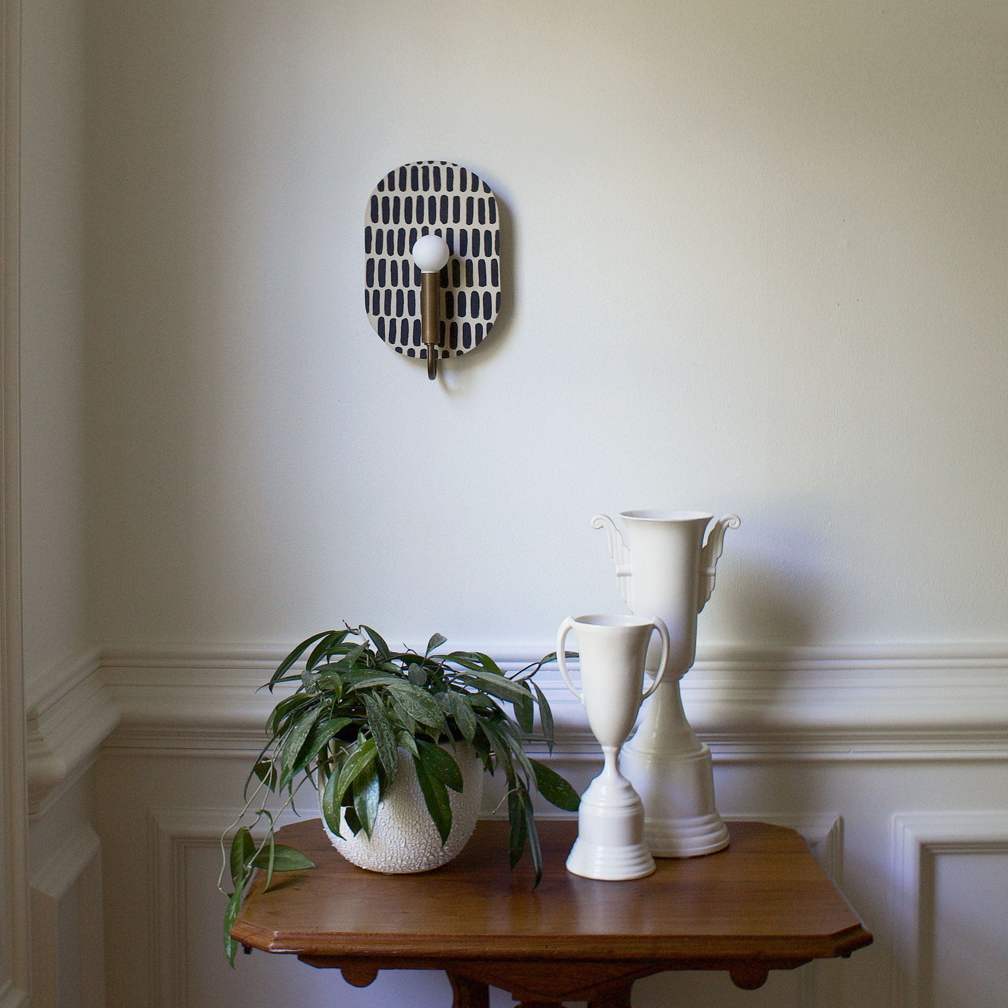 Concord ADA shown in Heirloom Brass with Black & Cream Dot Stripe ceramic