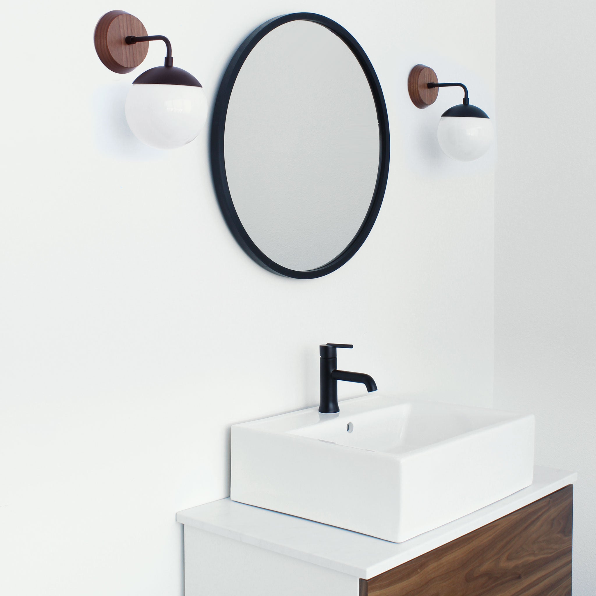 Alto Sconce 6" with Wood Canopy shown in Matte Black and Walnut canopy with an Opal 6" globe
