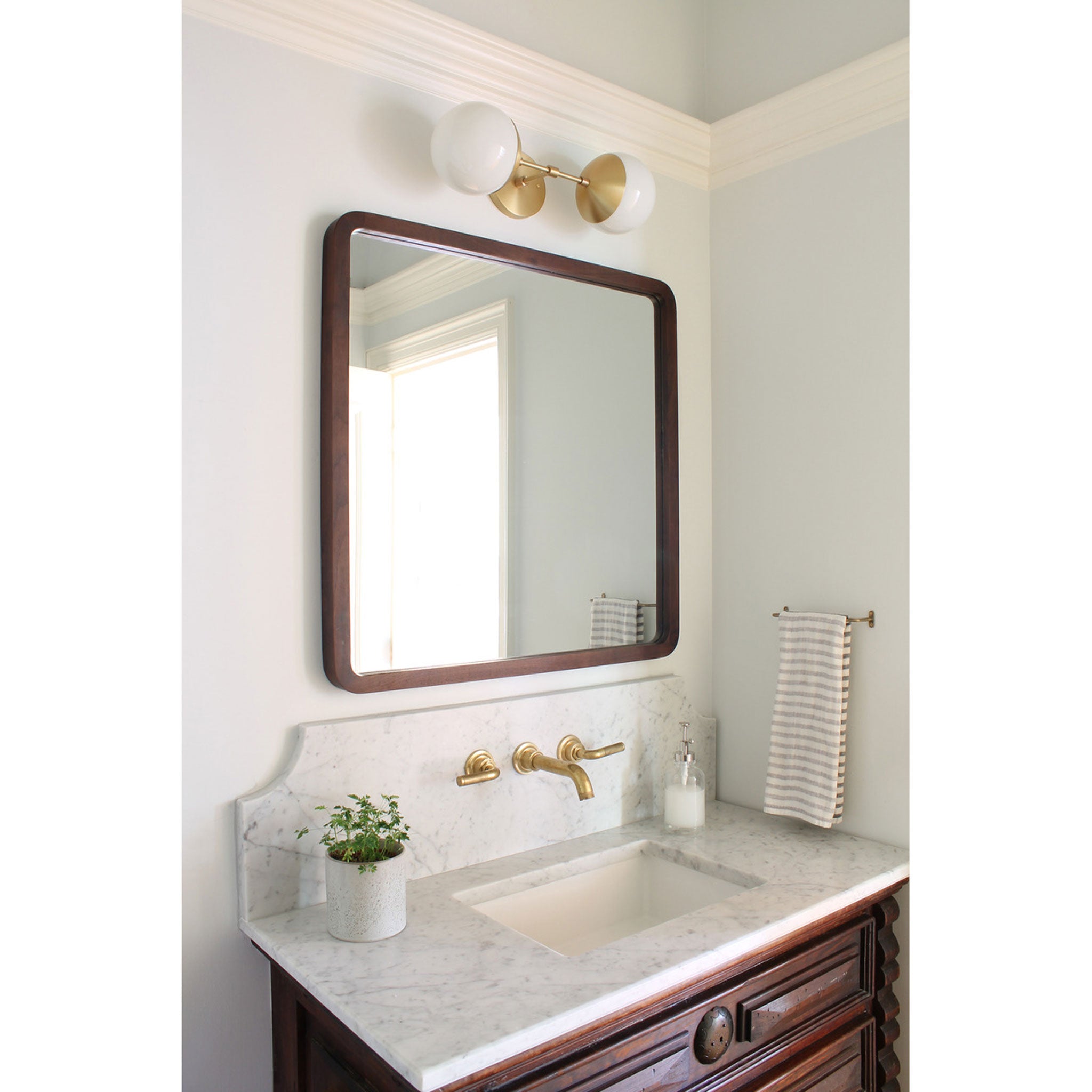 Theo shown in Brass with Opal 6" globes