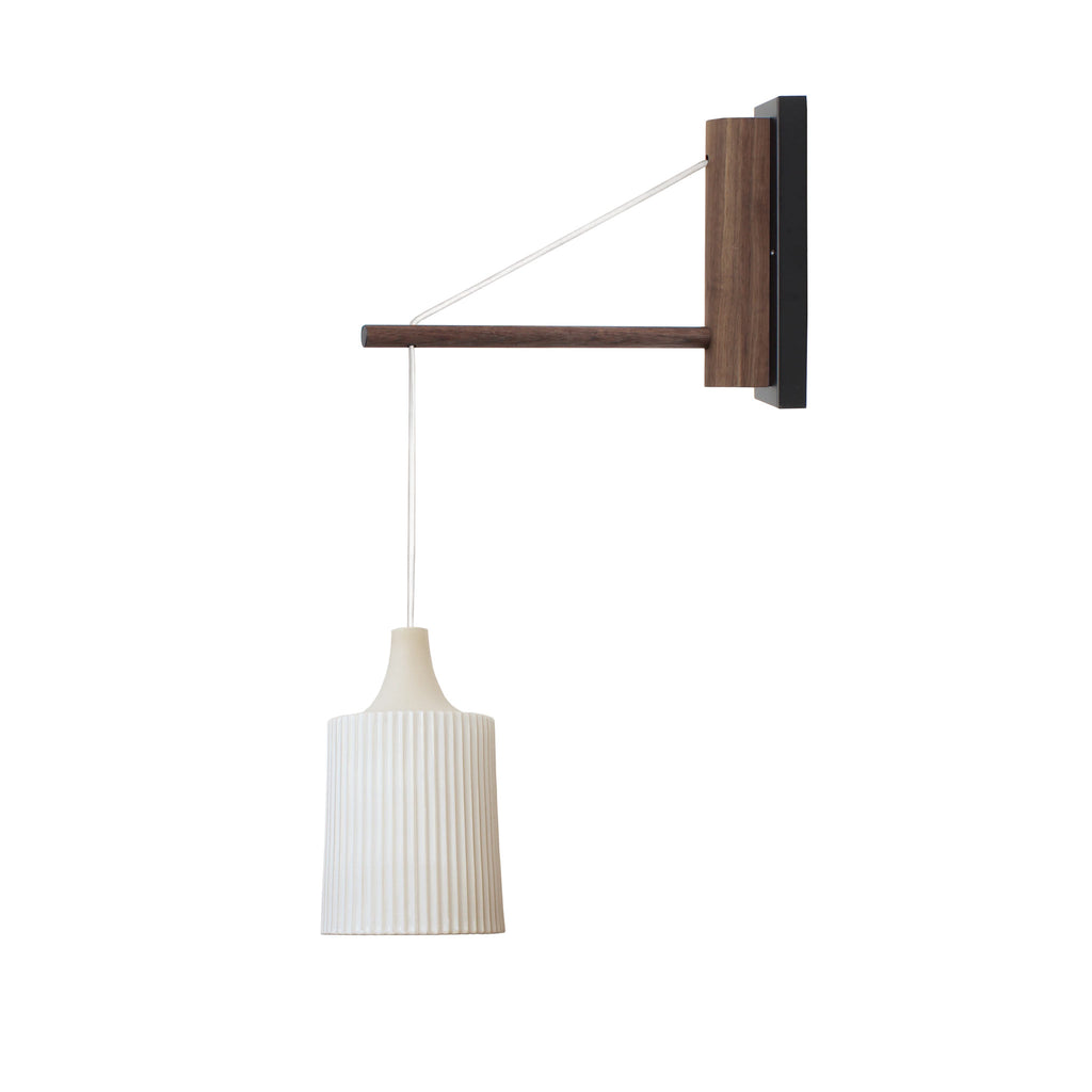 Tumwater 14" Wood Arm Sconce shown in Matte Black with Walnut and a White Hardwired Cord. 