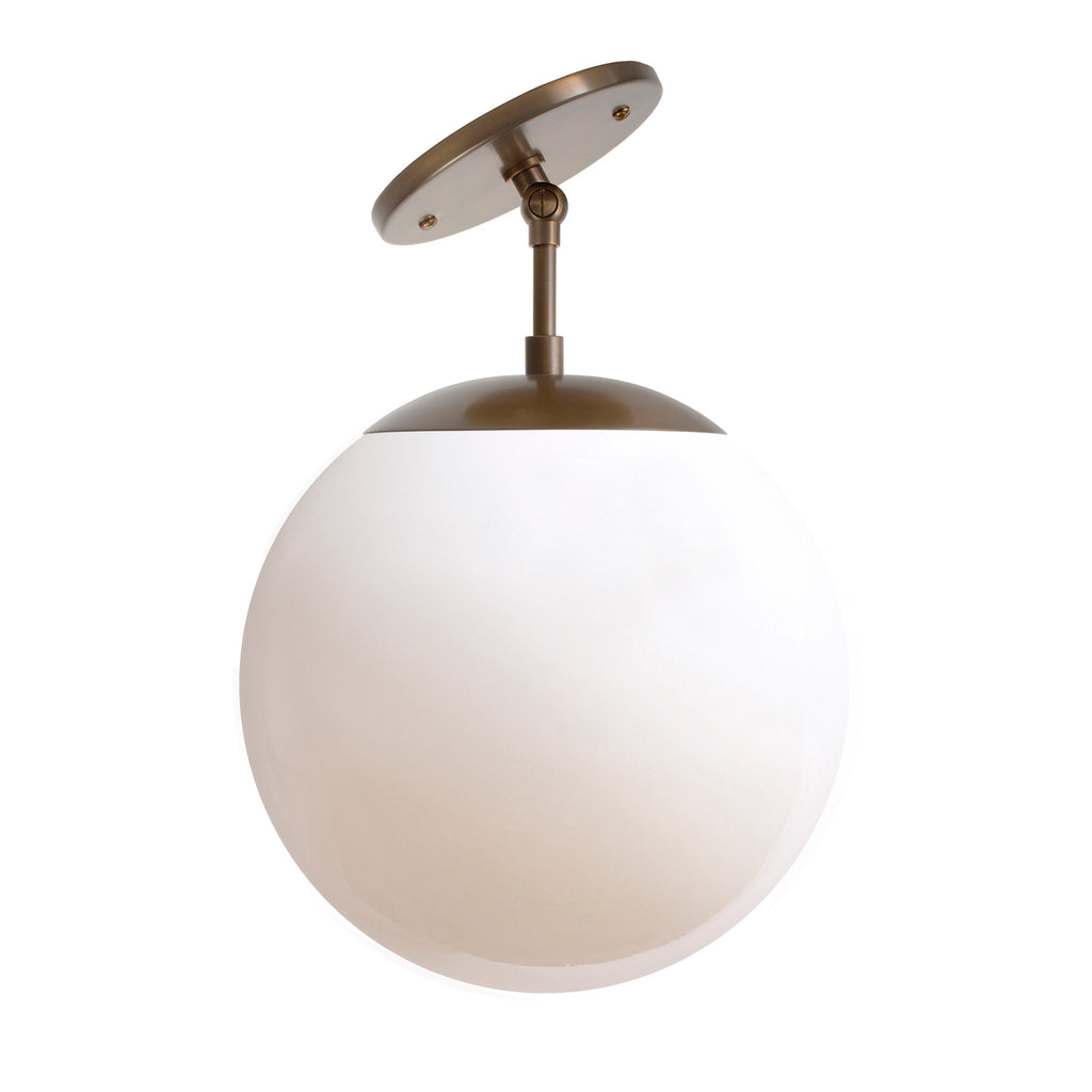 Alto Surface 10" for Vaulted Ceiling shown in Heirloom Brass with a Clear 10" globe.