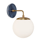 Alto Sconce 8” shown in Heirloom Brass with an Indigo Blue Swift Ceramic Canopy