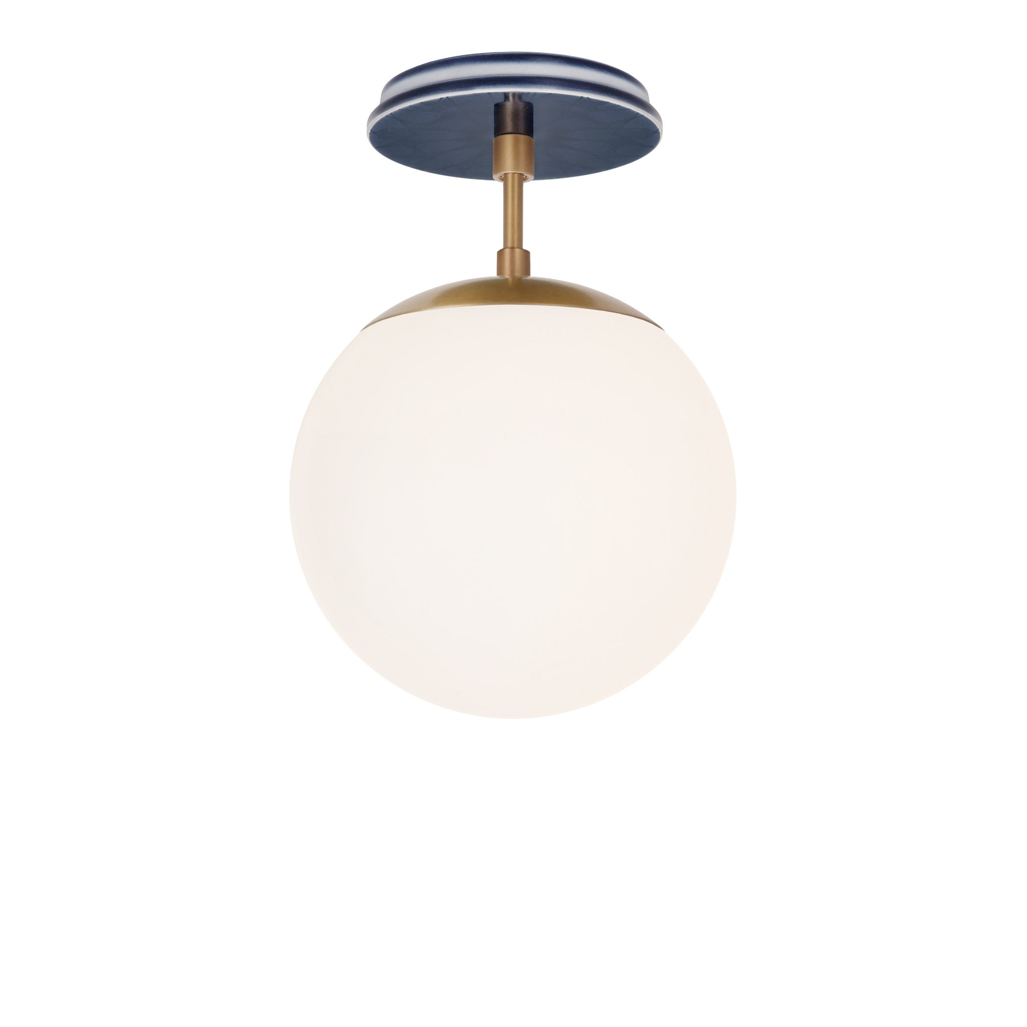 Alto Surface 8" shown in Heirloom Brass with an Indigo Blue Star Ceramic Canopy