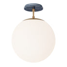 Alto Surface 12” shown in Heirloom Brass with an Indigo Blue Sunflower Ceramic Canopy