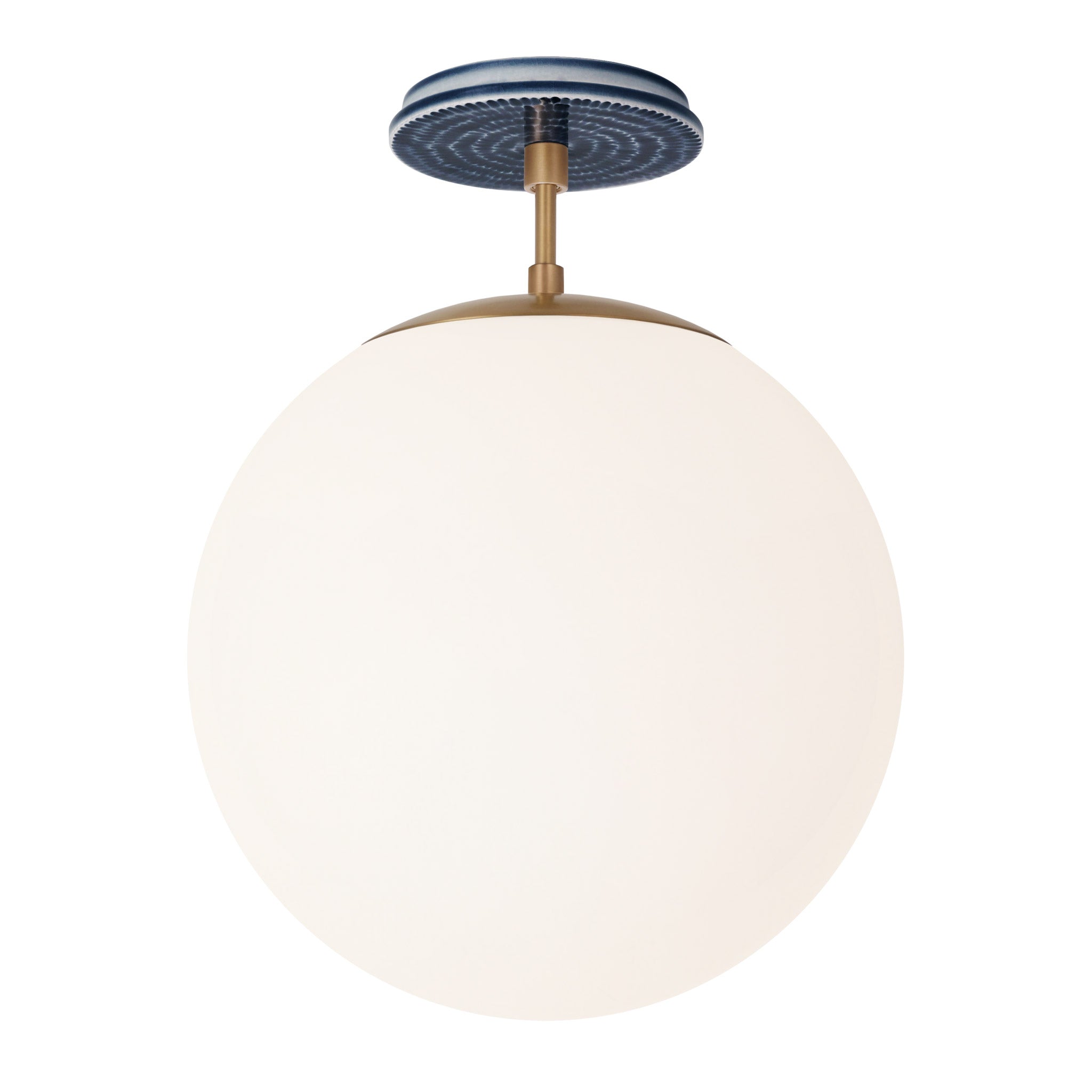 Alto Surface 12” shown in Heirloom Brass with an Indigo Blue Sunflower Ceramic Canopy