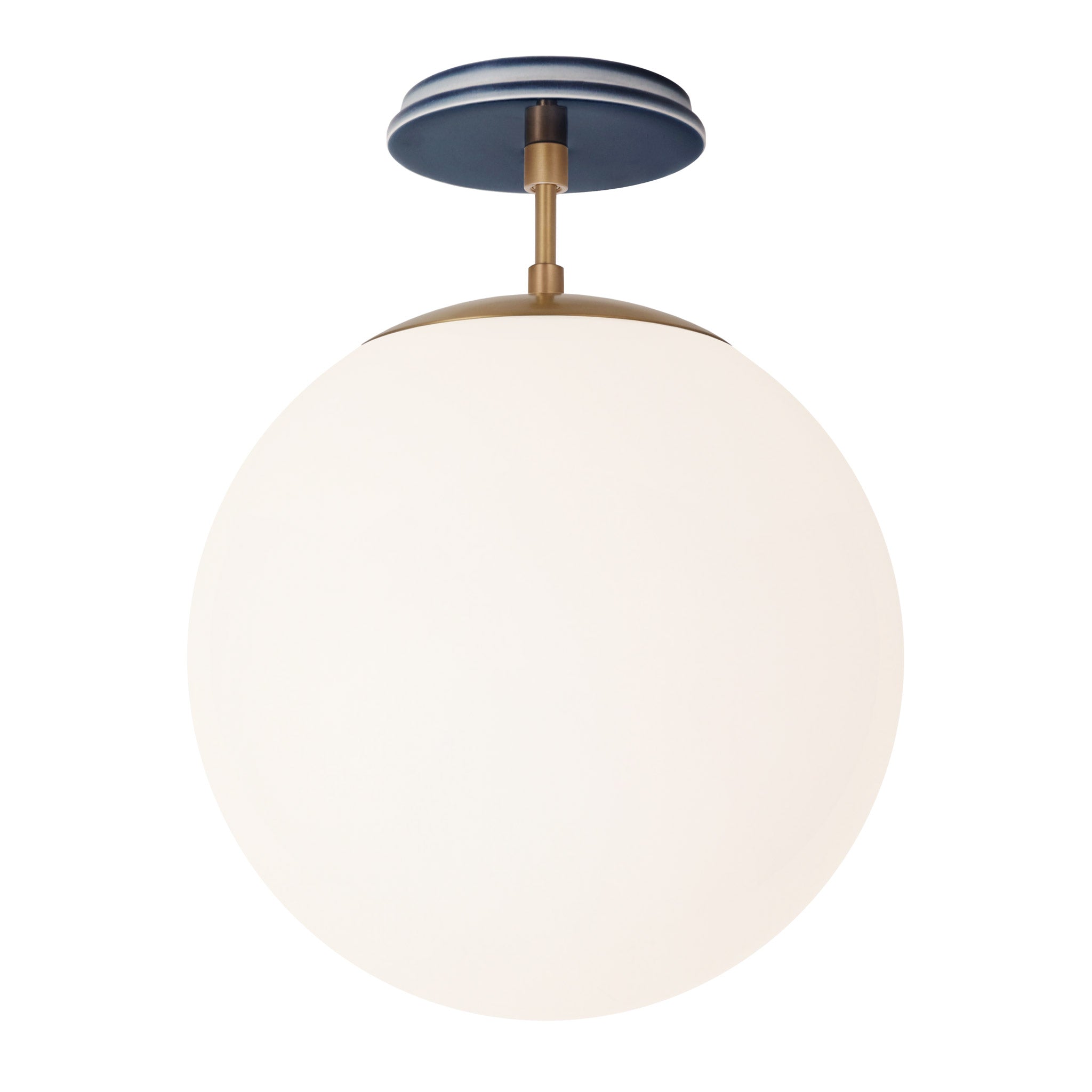 Alto Surface 12” shown in Heirloom Brass with an Indigo Blue Swift Ceramic Canopy