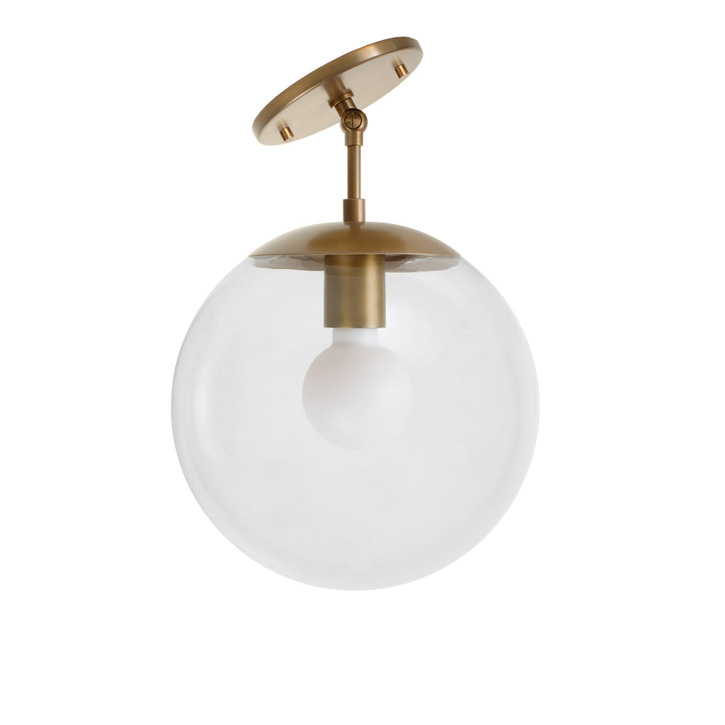 Alto Surface 10" for Vaulted Ceiling shown in Heirloom Brass with a Clear 10" globe