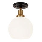 Beatrix Surface shown in Heirloom Brass with a Gloss Black Ceramic Canopy